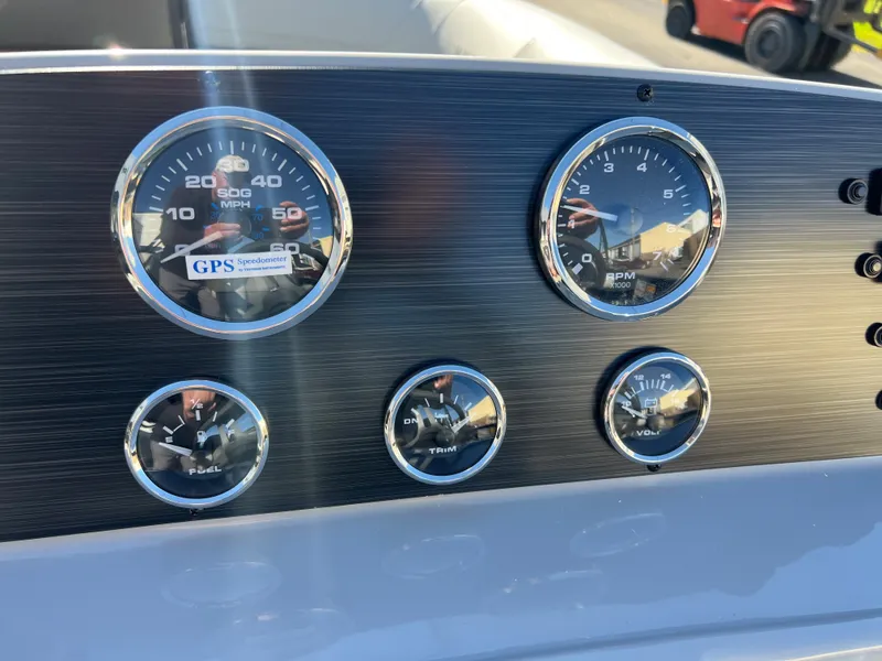 Slide: The Image of Dashboard with speed and fuel gauges. - 16