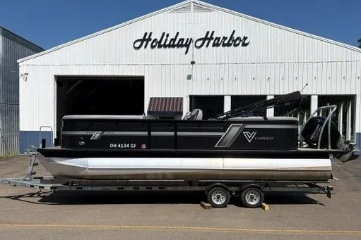 Slide: The Image of 2023 Viaggio Lago 22U Tri Toon Mercury 150 boat on trailer at Holiday Harbor. - 1