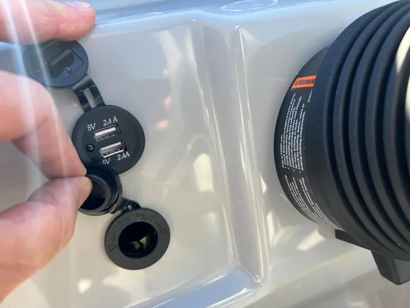 Slide: The Image of Close-up of USB ports and a charger on a boat. - 18