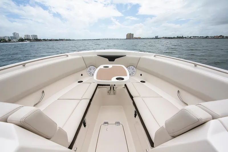 Slide: The Image of Manufacturer Provided Image: 2026 Sailfish 316 DC boat interior with seating and table on open water. - 6