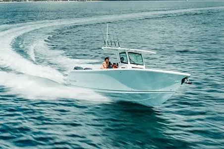 Slide: The Image of Manufacturer Provided Image: 2026 Sailfish 312 CC boat cruising on open water, showcasing speed and sleek design. - 3