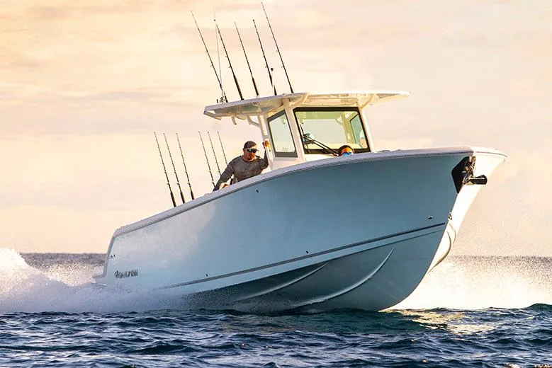 The Image of Manufacturer Provided Image: 2026 Sailfish 312 CC boat cruising on open water at sunset. - 0