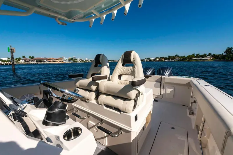 Slide: The Image of Manufacturer Provided Image: 2026 Sailfish 312 CC boat interior with luxurious seating on a sunny day. - 9