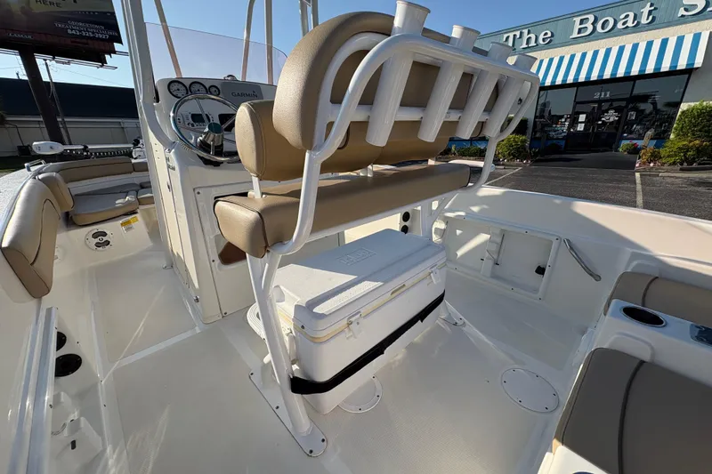 Slide: The Image of 2019 NauticStar 231 Hybrid boat interior with seating and steering console. - 11