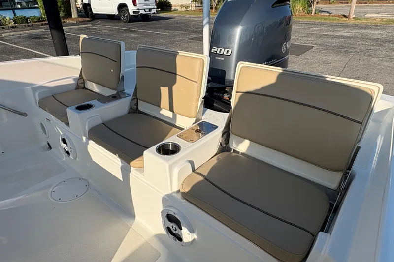 Slide: The Image of 2019 NauticStar 231 Hybrid boat seats with cup holders and Yamaha 200 engine. - 8