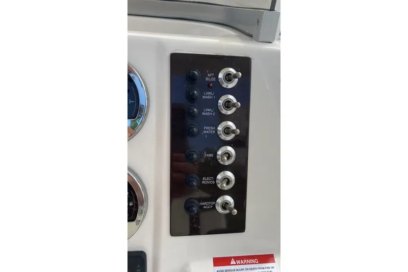Slide: The Image of Control panel of 2017 Robalo R222 Center Console boat with labeled switches. - 8