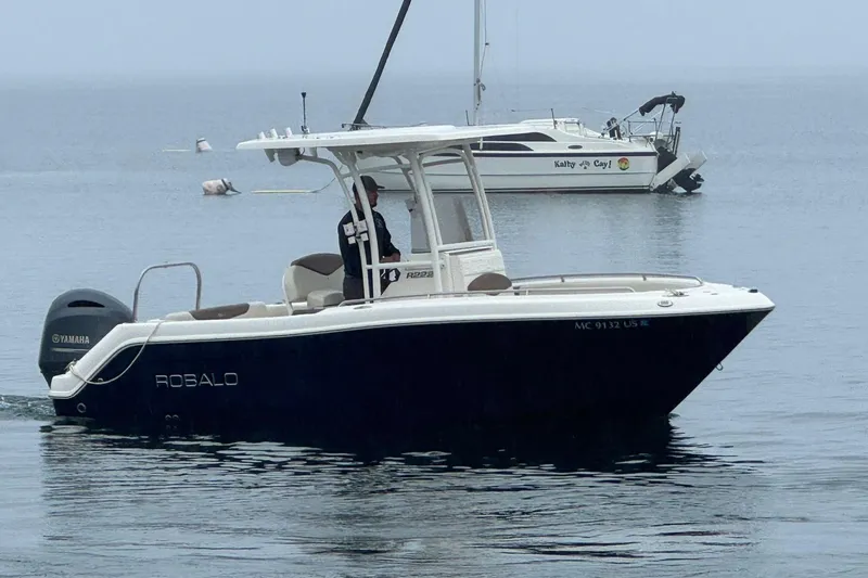 Slide: The Image of 2017 Robalo R222 Center Console boat on calm water with Yamaha engine. - 4