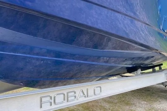 Slide: The Image of 2017 Robalo R222 Center Console boat on trailer, close-up view. - 2