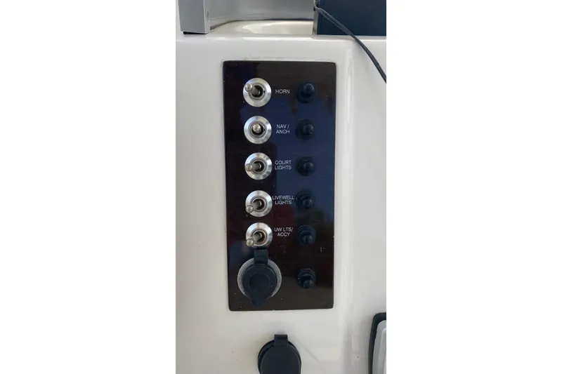 Slide: The Image of Control panel of a 2017 Robalo R222 Center Console boat with labeled switches. - 9