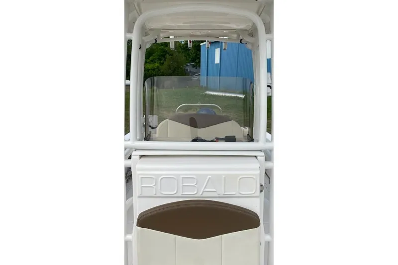Slide: The Image of 2017 Robalo R222 Center Console boat interior with windshield and seating. - 6