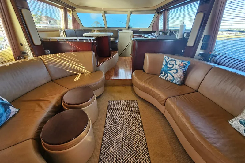 Slide: The Image of Luxurious interior of 2006 Sea Ray 580 Sedan Bridge yacht with leather seating and elegant decor. - 24