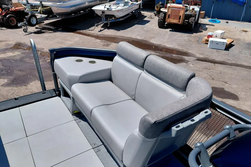 Slide: The Image of 2024 Sea-Doo Switch Cruise 18 boat interior with comfortable seating and cup holders. - 9
