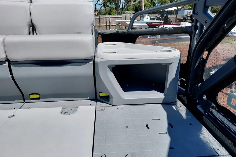 Slide: The Image of 2024 Sea-Doo Switch Cruise 18 interior seating with storage and cup holders. - 25