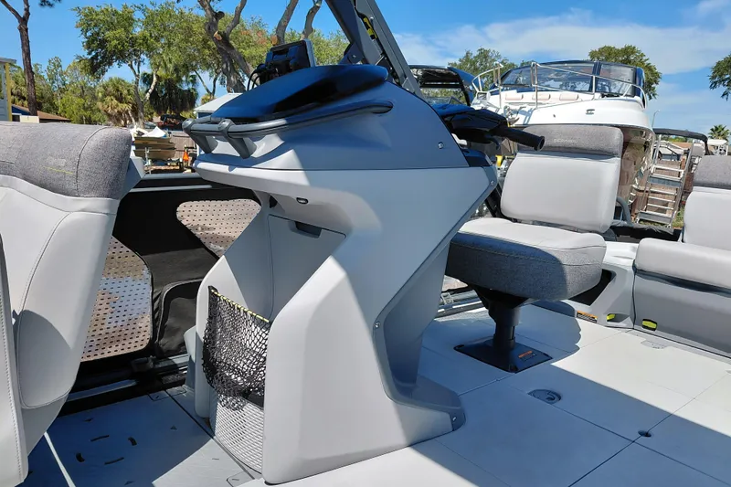 Slide: The Image of 2024 Sea-Doo Switch Cruise 18 interior with modern seating and steering console. - 14