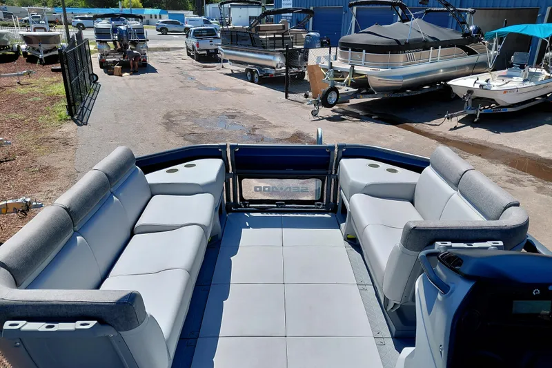 Slide: The Image of 2024 Sea-Doo Switch Cruise 18 pontoon boat interior with spacious seating and modern design. - 19