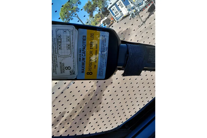 Slide: The Image of 2024 Sea-Doo Switch Cruise 18 capacity label, maximum 8 persons or 1,155 lbs. - 23