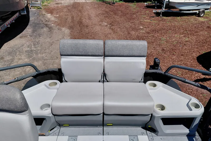 Slide: The Image of 2024 Sea-Doo Switch Cruise 18 interior seating with cup holders, showcasing comfort and functionality. - 27