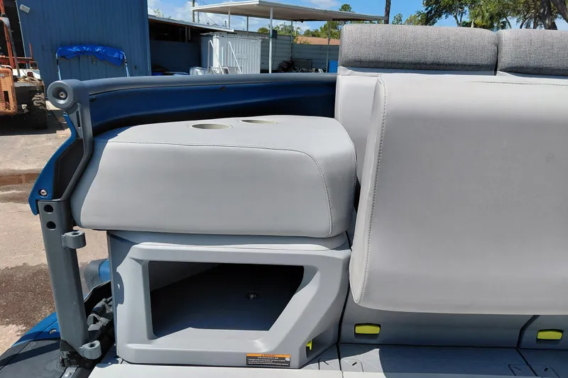 Slide: The Image of 2024 Sea-Doo Switch Cruise 18 interior seating with storage compartment and cup holders. - 12