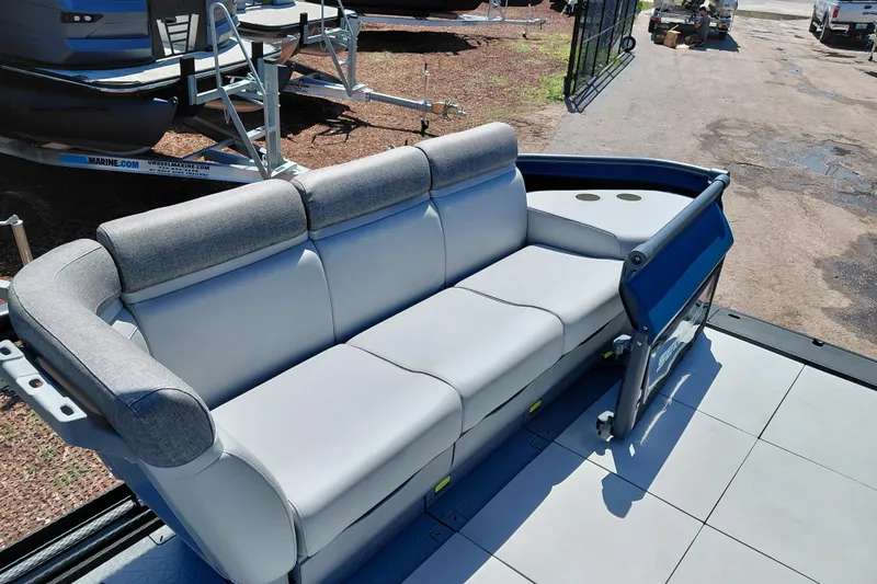 Slide: The Image of 2024 Sea-Doo Switch Cruise 18 boat interior with comfortable seating and cup holders. - 15