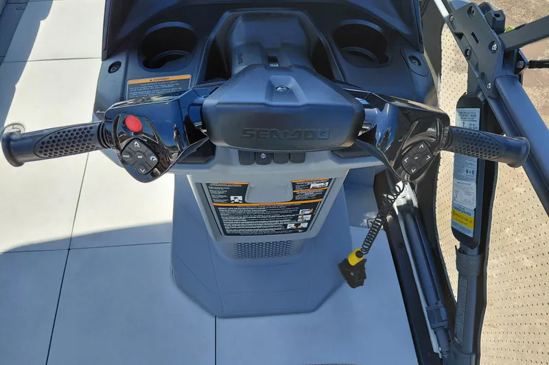Slide: The Image of 2024 Sea-Doo Switch Cruise 18 steering console with controls and safety features. - 22