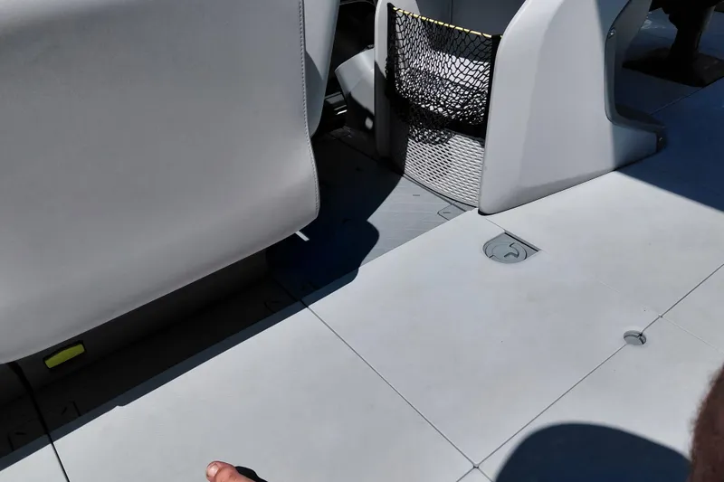 Slide: The Image of Interior view of 2024 Sea-Doo Switch Cruise 18 with seating and storage net. - 13