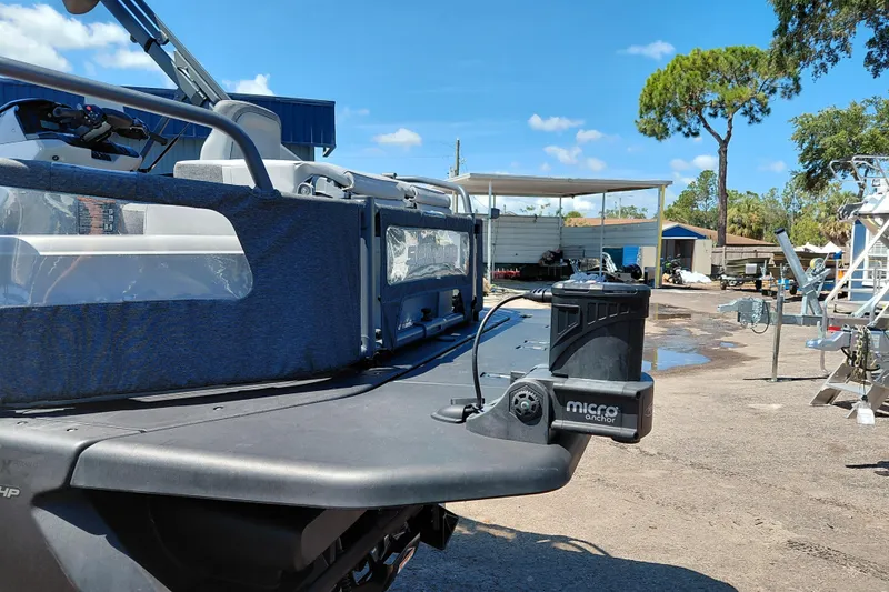 Slide: The Image of 2024 Sea-Doo Switch Cruise 18 with micro anchor, parked outdoors under clear sky. - 34