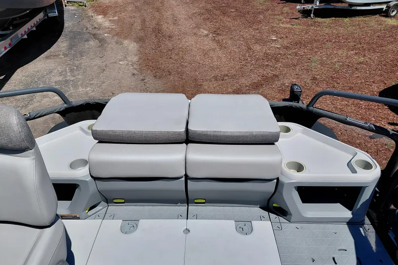 Slide: The Image of 2024 Sea-Doo Switch Cruise 18 interior with cushioned seating and cup holders. - 28