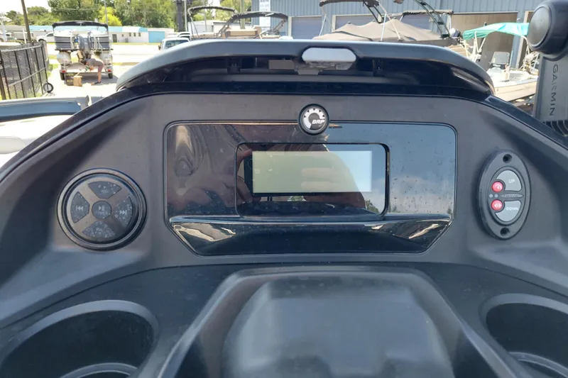 Slide: The Image of 2024 Sea-Doo Switch Cruise 18 dashboard with control panel and display screen. - 21