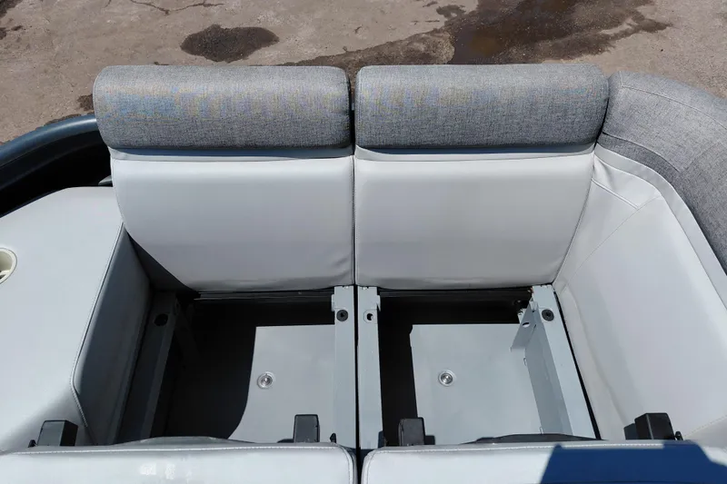 Slide: The Image of 2024 Sea-Doo Switch Cruise 18 interior seating with storage compartments, featuring gray upholstery. - 11