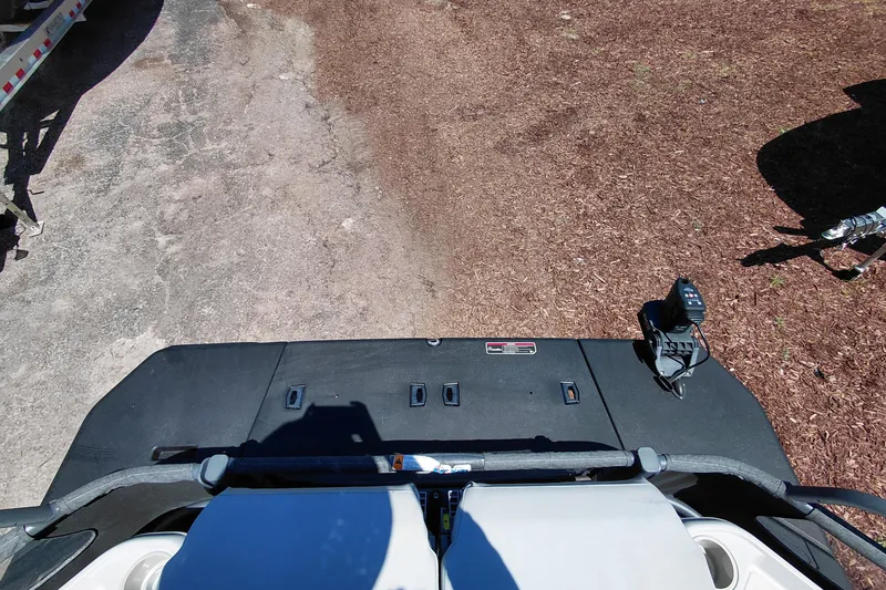 Slide: The Image of 2024 Sea-Doo Switch Cruise 18 rear deck view with control panel and seating. - 31