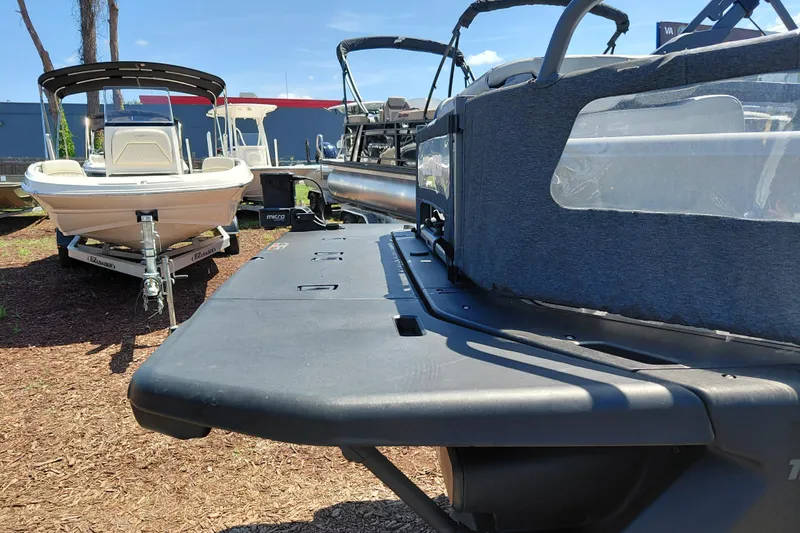 Slide: The Image of 2024 Sea-Doo Switch Cruise 18 pontoon boat displayed outdoors, showcasing sleek design and modern features. - 33