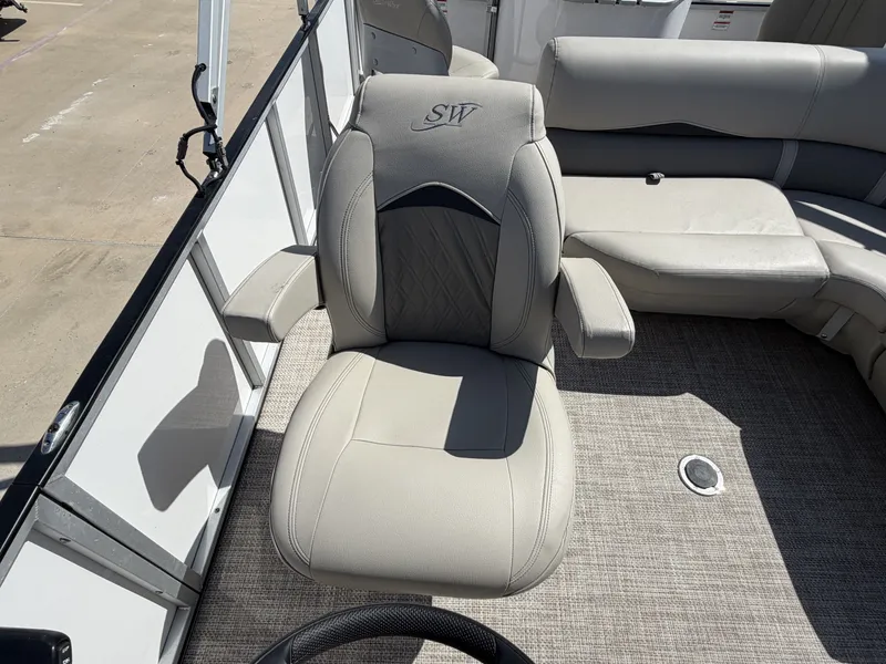 Slide: The Image of A luxurious captain's chair with armrests on a boat, surrounded by gray carpeting. - 24