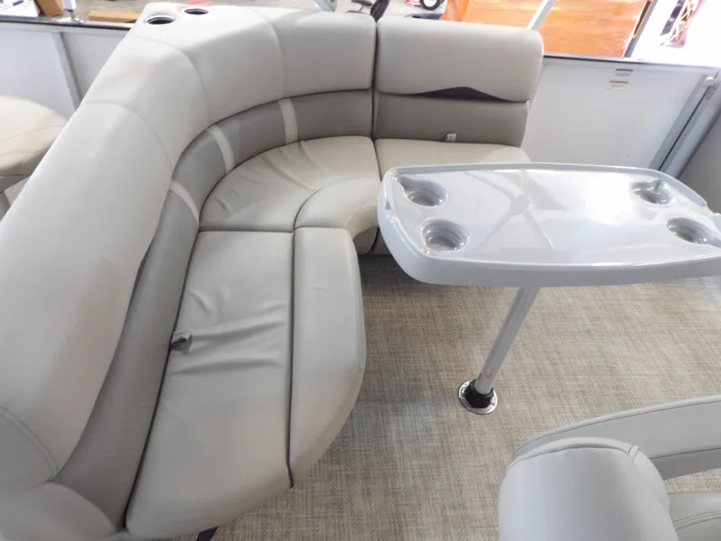 Slide: The Image of The image shows an elegant gray seating area with a table featuring built-in cup holders. - 15