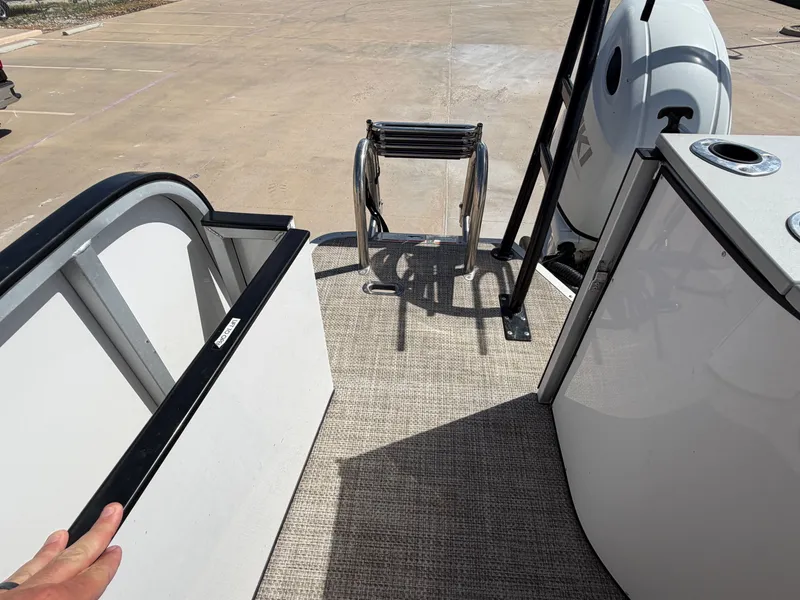 Slide: The Image of View of a SilverWave 2410 RLP SW3 boat deck with ladder and railing. - 33