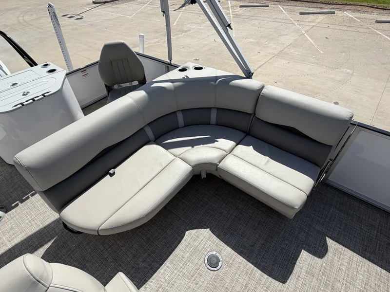 Slide: The Image of The image shows a gray, cushioned seating area on a boat, surrounded by an open deck. - 25
