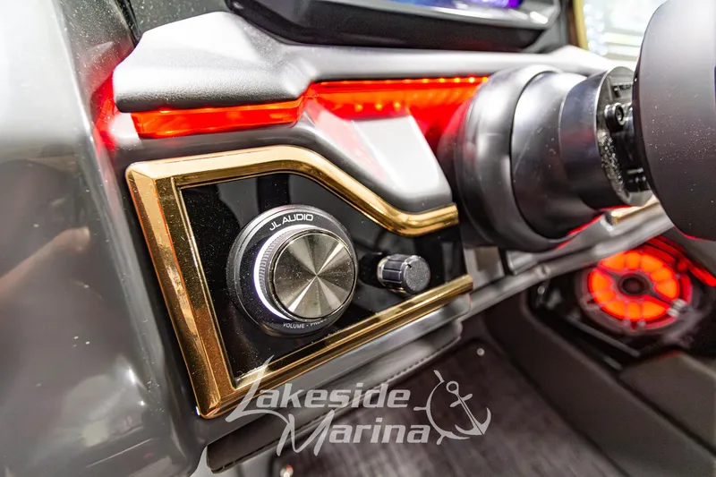 Slide: The Image of Dashboard of 2026 Godfrey Sanpan 2700 MTF with JL Audio controls and red lighting. - 36