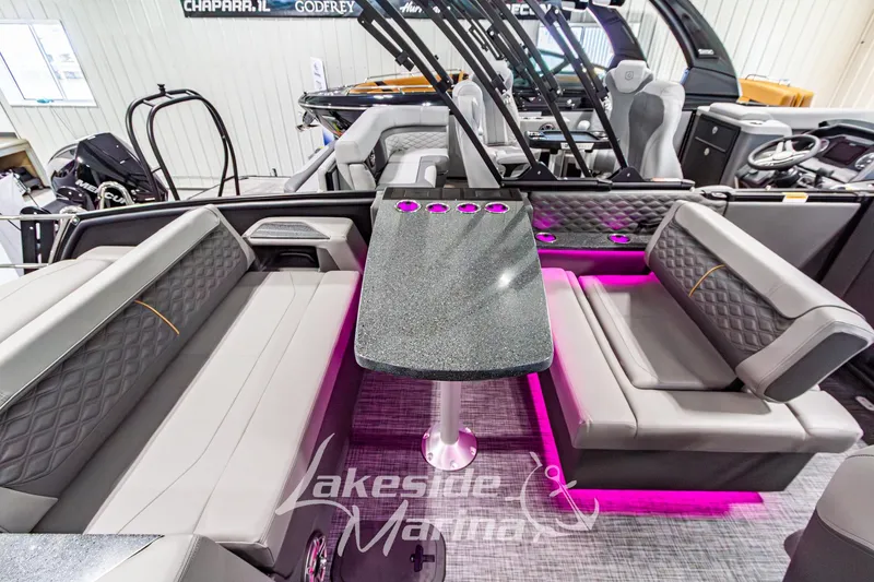 Slide: The Image of Luxurious 2026 Godfrey Sanpan 2700 MTF pontoon interior with plush seating and ambient lighting. - 43