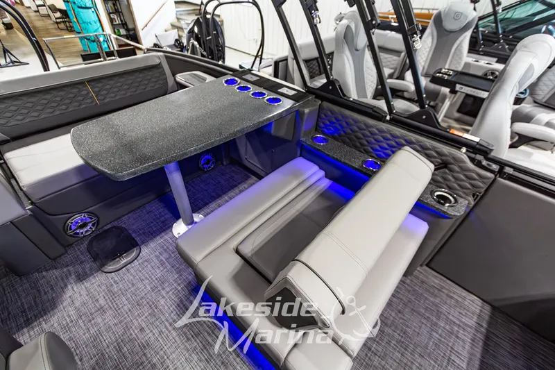 Slide: The Image of Luxurious interior of 2026 Godfrey Sanpan 2700 MTF pontoon boat with seating and table. - 30