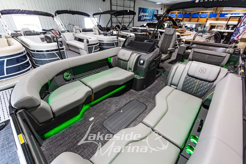 Slide: The Image of Luxurious 2026 Godfrey Sanpan 2700 MTF pontoon boat interior at Lakeside Marina showroom. - 14
