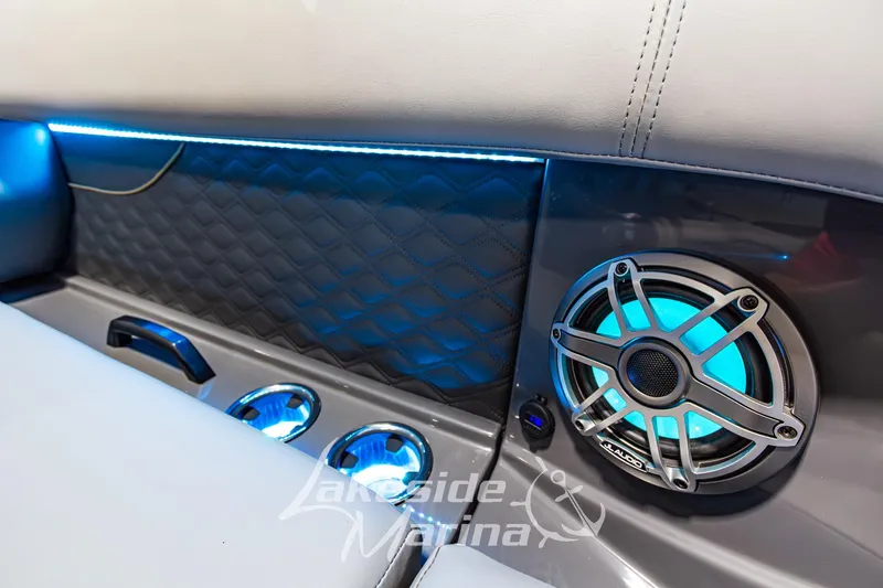 Slide: The Image of Interior of 2026 Godfrey Sanpan 2700 MTF with illuminated speaker and cup holders. - 20