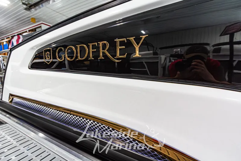 Slide: The Image of Close-up of 2026 Godfrey Sanpan 2700 MTF boat with gold lettering and sleek design. - 8