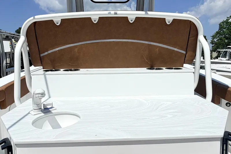Slide: The Image of 2027 Sea Hunt Ultra 275 SE boat interior with sink and seating area. - 6