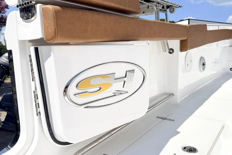 Slide: The Image of 2027 Sea Hunt Ultra 275 SE boat interior with logo and seating. - 3