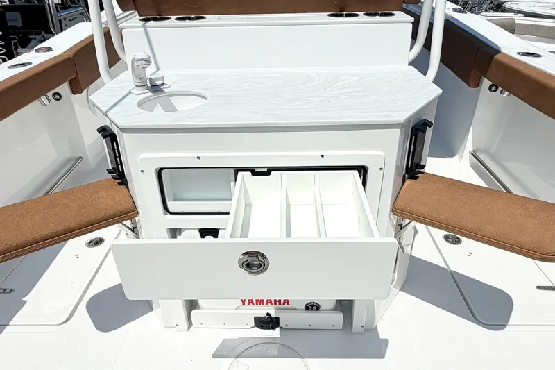 Slide: The Image of 2027 Sea Hunt Ultra 275 SE boat interior with storage compartments and seating. - 7