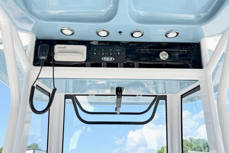 Slide: The Image of Interior view of 2027 Sea Hunt Ultra 275 SE boat console with Garmin equipment. - 12