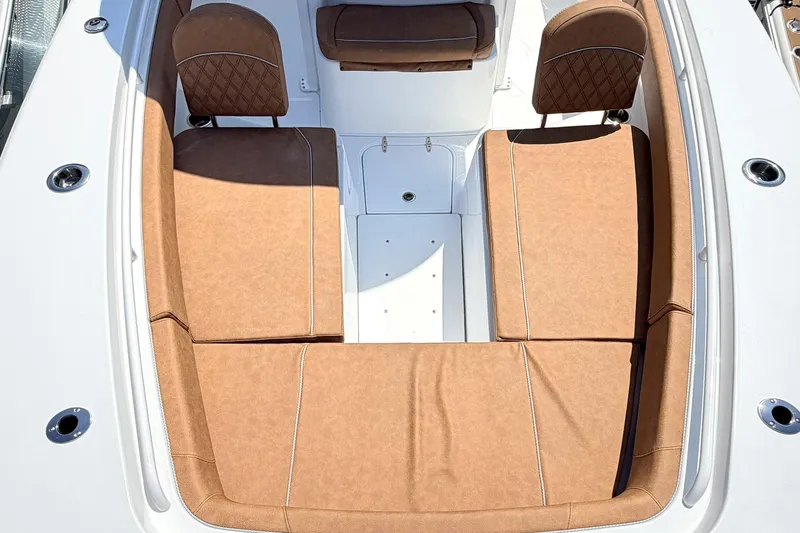 Slide: The Image of Luxurious seating on 2027 Sea Hunt Ultra 275 SE boat, featuring tan upholstery and sleek design. - 24