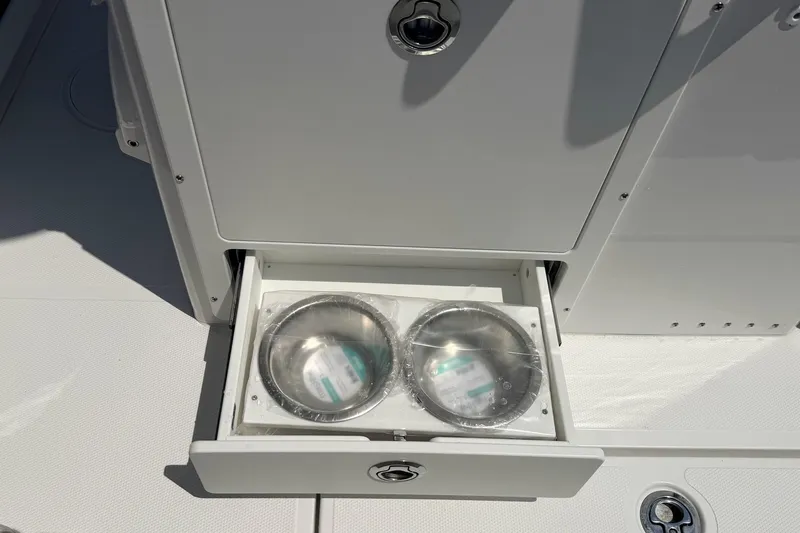 Slide: The Image of Drawer with dual stainless steel bowls on a 2027 Sea Hunt Ultra 275 SE boat. - 9