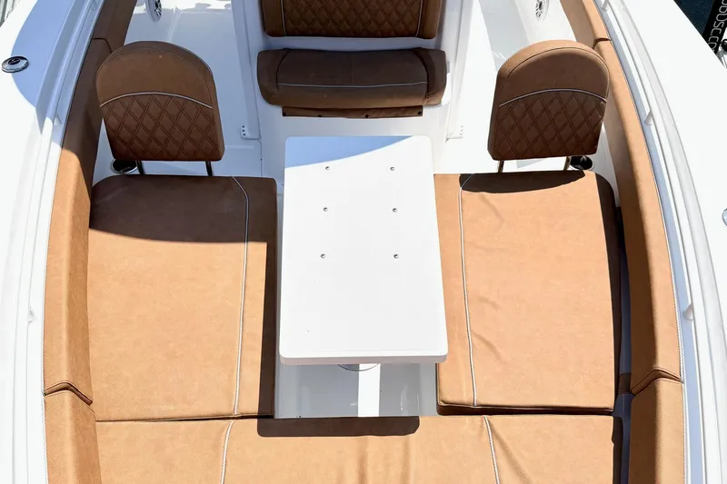 Slide: The Image of Luxurious seating area on 2027 Sea Hunt Ultra 275 SE boat with brown cushions. - 29