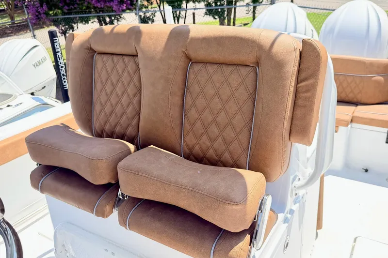 Slide: The Image of Luxurious brown seating on 2027 Sea Hunt Ultra 275 SE boat, featuring diamond stitching. - 13
