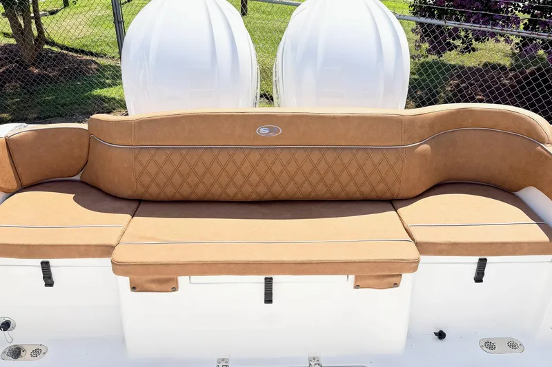 Slide: The Image of 2027 Sea Hunt Ultra 275 SE boat with tan cushioned seating and elegant design. - 15